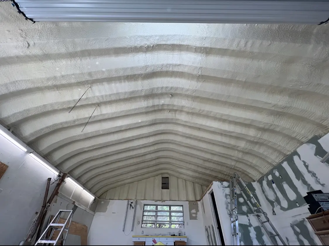 Spray polyurethane foam applied to the underside of a metal roof deck in Sunrise Manor